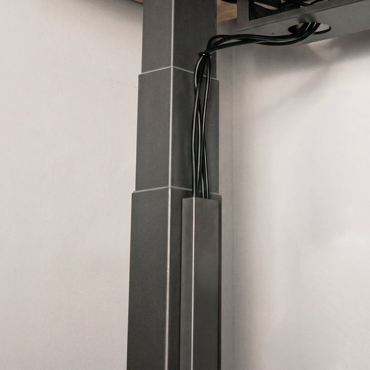 Black magnetic cable management on desk frame